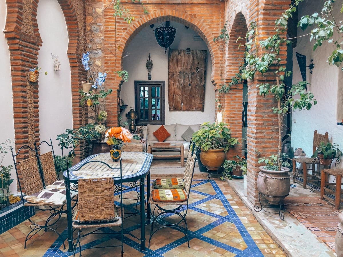 Horseshoe arches, zellige tile, and courtyard light — al-Andalus carried into the present.